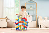 Child behind VTech Toot-Toot Drivers Criss-Cross Raceway in a bedroom with the yellow car at the front