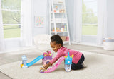 Child kneeling on rug with VTech Toot-Toot Drivers Disney Princess Enchanted Castle Slide and Cinderella carriage