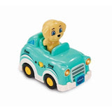 VTech Toot-Toot Drivers roadster with teal body, yellow wheels and dog character seated inside