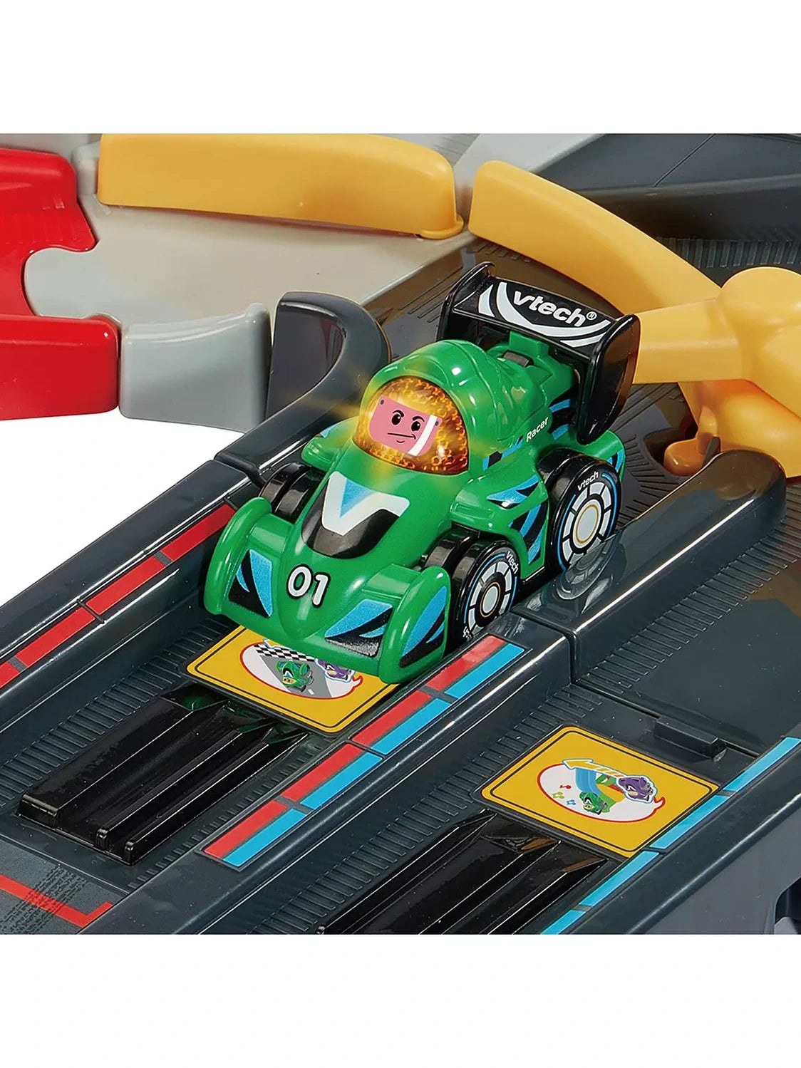 VTech Toot-Toot Drivers green number 01 V Racer positioned on the black SmartPoint track beside yellow route gates
