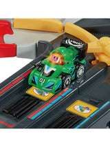 VTech Toot-Toot Drivers green number 01 V Racer positioned on the black SmartPoint track beside yellow route gates