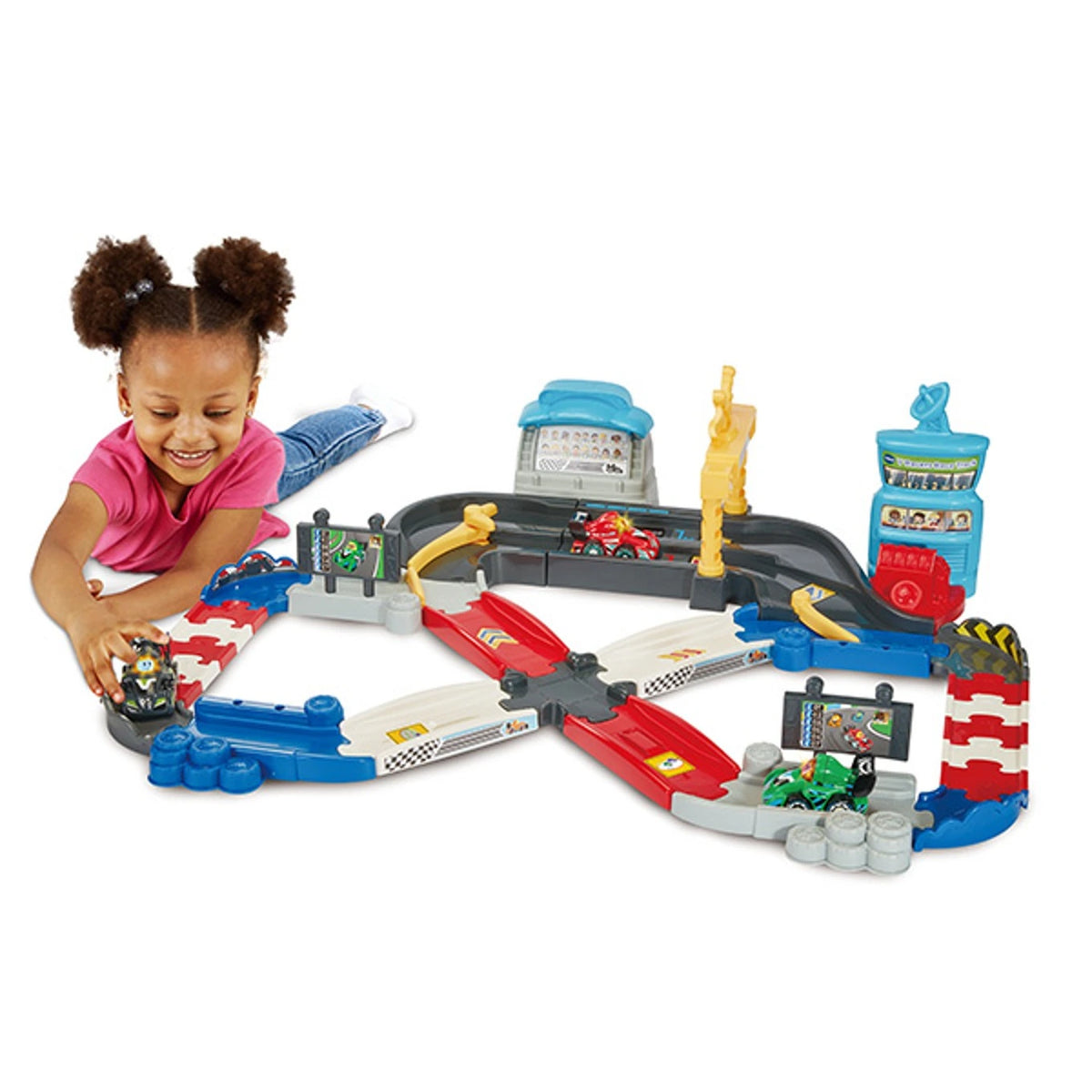 Child playing with the VTech Toot-Toot Drivers V Racers Race Track with green, red and black racers on the connected track