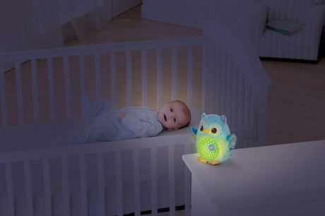 Baby with VTech Twinkle Lights Owl soft toy glowing in room – Ireland