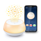 VTech V-Hush Mini Sleep Soother projecting stars beside a phone displaying the mobile app
