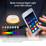 VTech V-Hush Mini Sleep Soother glowing beside a phone displaying night light colour controls
