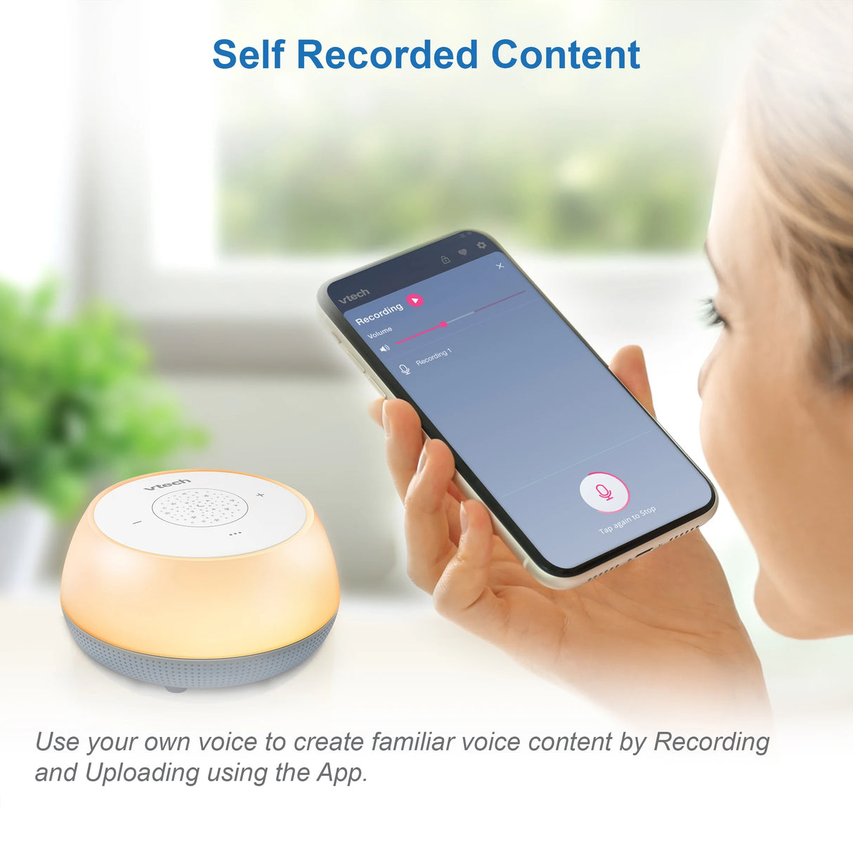 Person using a phone beside the VTech V-Hush Mini Sleep Soother with self recorded content graphic