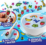 Water Art 12 Pack showing hand drawing strawberry design on spoon then dipping into water to create floating art