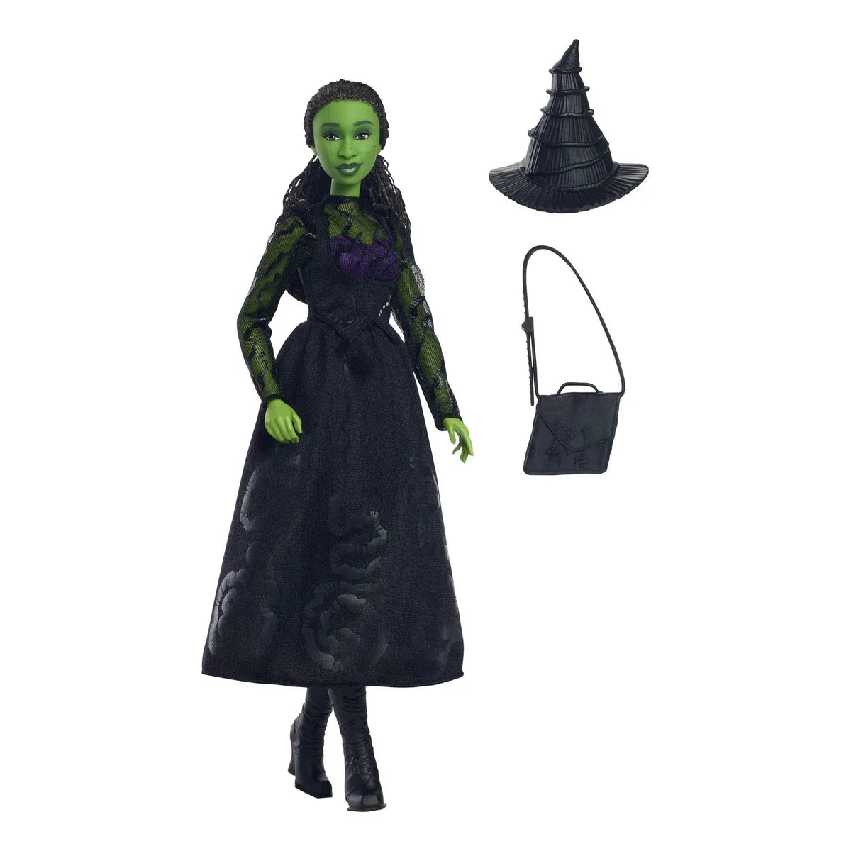 Elphaba doll standing with green skin and braid, alongside hat, boots, and school bag on white background