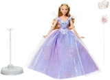Glinda doll standing with wand, tiara, sparkly organza dress, and display base arranged on white background