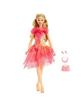 Glinda doll with her pink handbag, necklace, and hair clips arranged clearly beside her layered dress for easy viewing