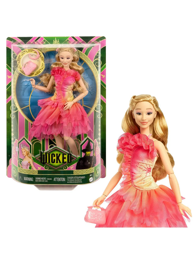 Glinda doll from the Wicked movie shown in bright retail packaging with her pink layered dress, long blonde hair, and matching accessories
