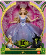 Wicked Glinda doll in display box wearing layered gown, with tiara, wand, and Try Me window visible on front packaging