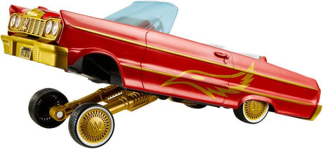 WWE Lucha Low Rider Vehicle side view with raised suspension, red body, gold graphics and white interior