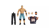 WWE WrestleMania Elite John Cena action figure shown with all included accessories: black trousers, swappable hands, number 54 Hustle Loyalty Respect jersey and orange and black cap