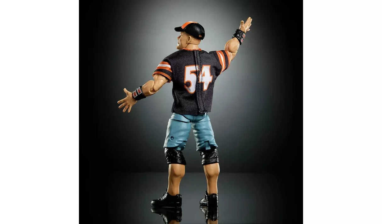 Rear view of the WWE WrestleMania Elite John Cena action figure wearing the number 54 jersey and blue shorts with arms outstretched