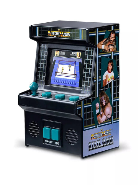 WWE WrestleMania Steel Cage Challenge Handheld Electronic Arcade Game, three-quarter view showing black cabinet with teal joystick and buttons, colour screen displaying gameplay and wrestler artwork on side panel