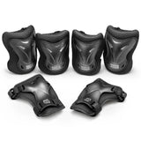 Xootz Kids Pad Set black large showing knee elbow and wrist pads arranged together on white background