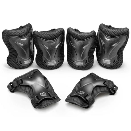 Xootz Kids Pad Set black large showing knee elbow and wrist pads arranged together on white background