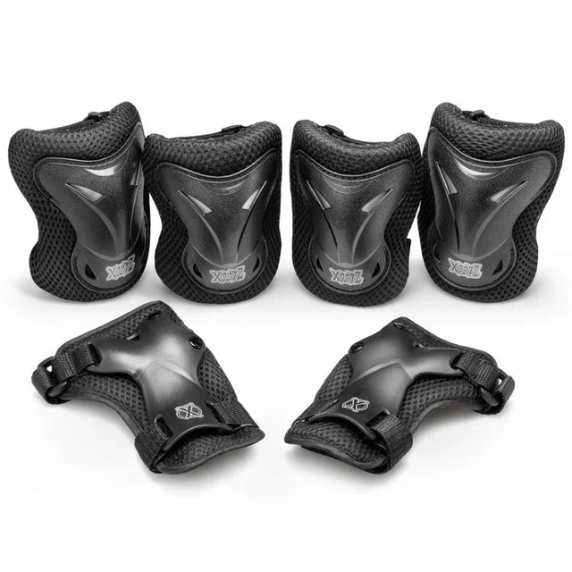 Xootz Kids Pad Set black large showing knee elbow and wrist pads arranged together on white background