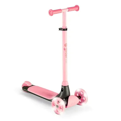 A pink Yvolution Glider Kiwi scooter with three wheels, LED light up fronts, soft grips, and an extra wide deck.