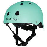 Green Yvolution kids helmet alternate front angled view showing shell curve, vents, and black straps on a white background