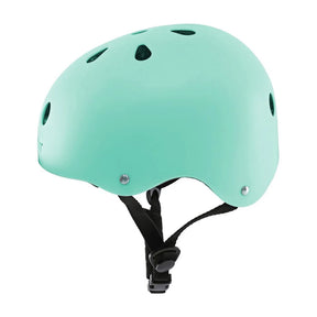 Green Yvolution kids helmet side view with round vents and black straps on a clean white background