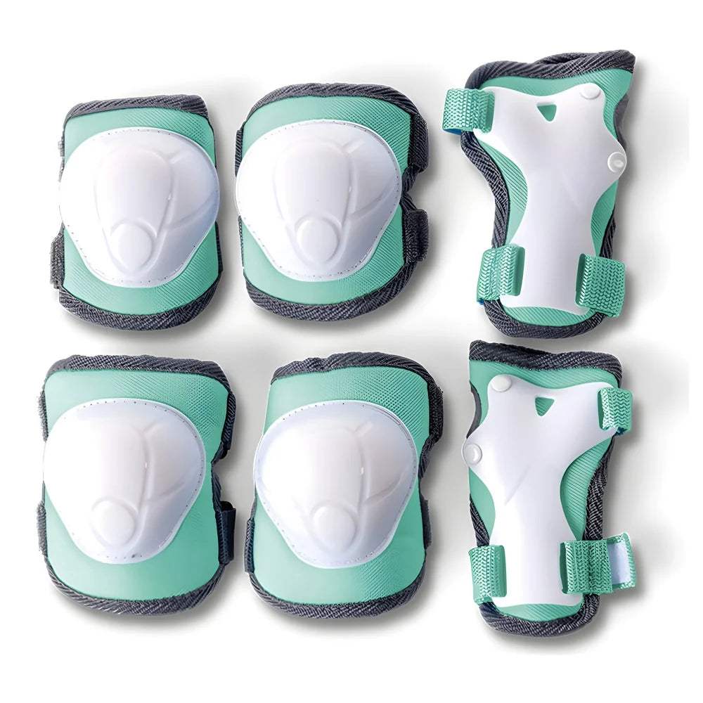 Green protective pads with cushioned shells and wrist guards laid out clearly