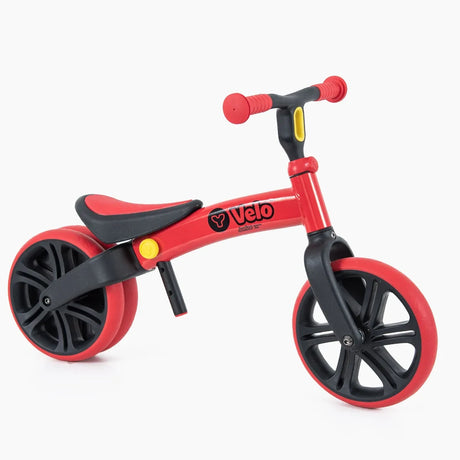 Yvolution Velo Junior Balance Bike Red shown from a front angle with dual rear wheel