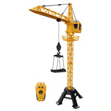 ZMX 99cm tower crane standing on a black base with lifting hook attachment and the yellow remote control beside it