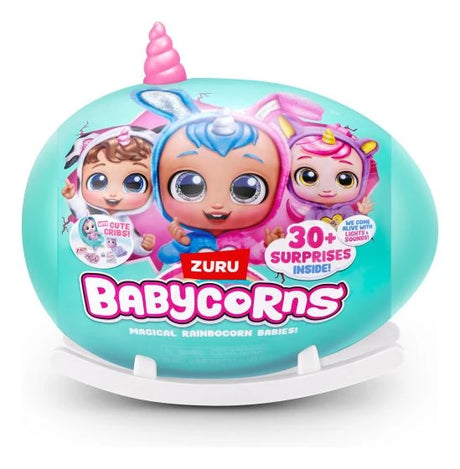Teal Babycorns Surprise egg with pink unicorn horn on white stand showing Babycorn characters and “30+ Surprises Inside” text on front